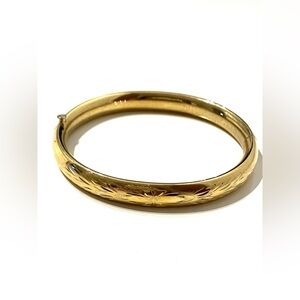 Vintage Monet Gold Tone Floral Engraved Bangle